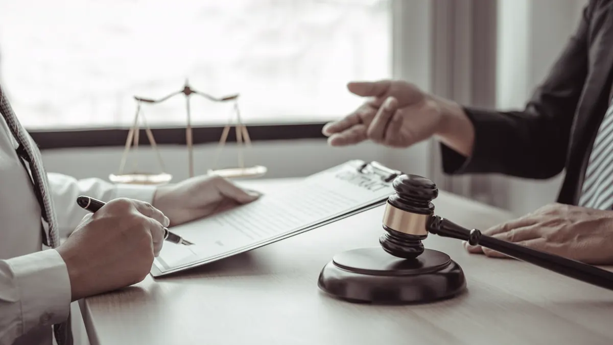 An attorney meeting with a client